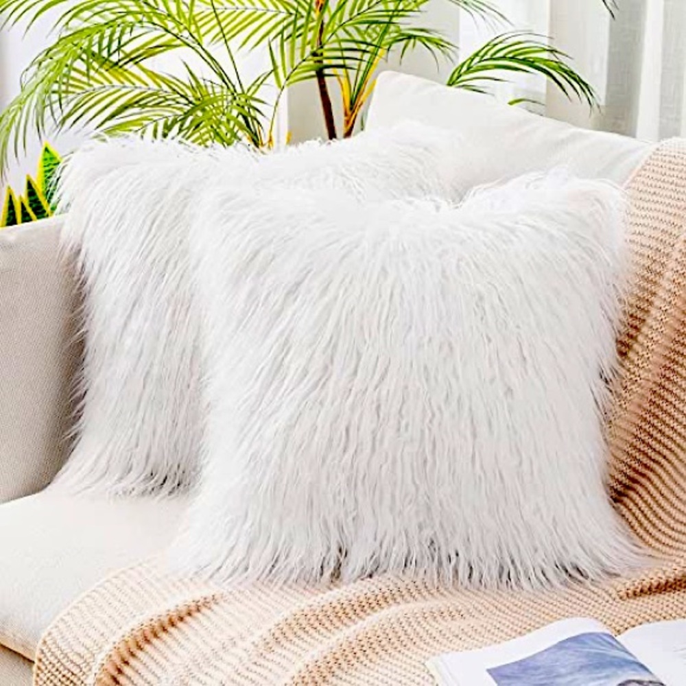 Set of three white faux fur throw pillow covers 22 x 22”.  Zipper closure.